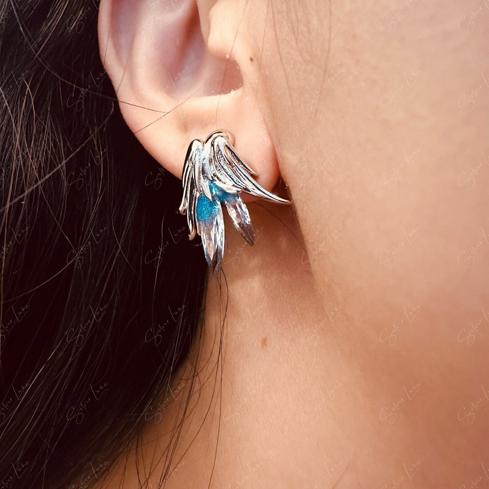 blue feather stud earrings