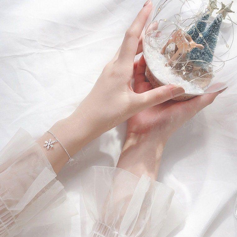 Dainty snowflake and crystal charm bracelet