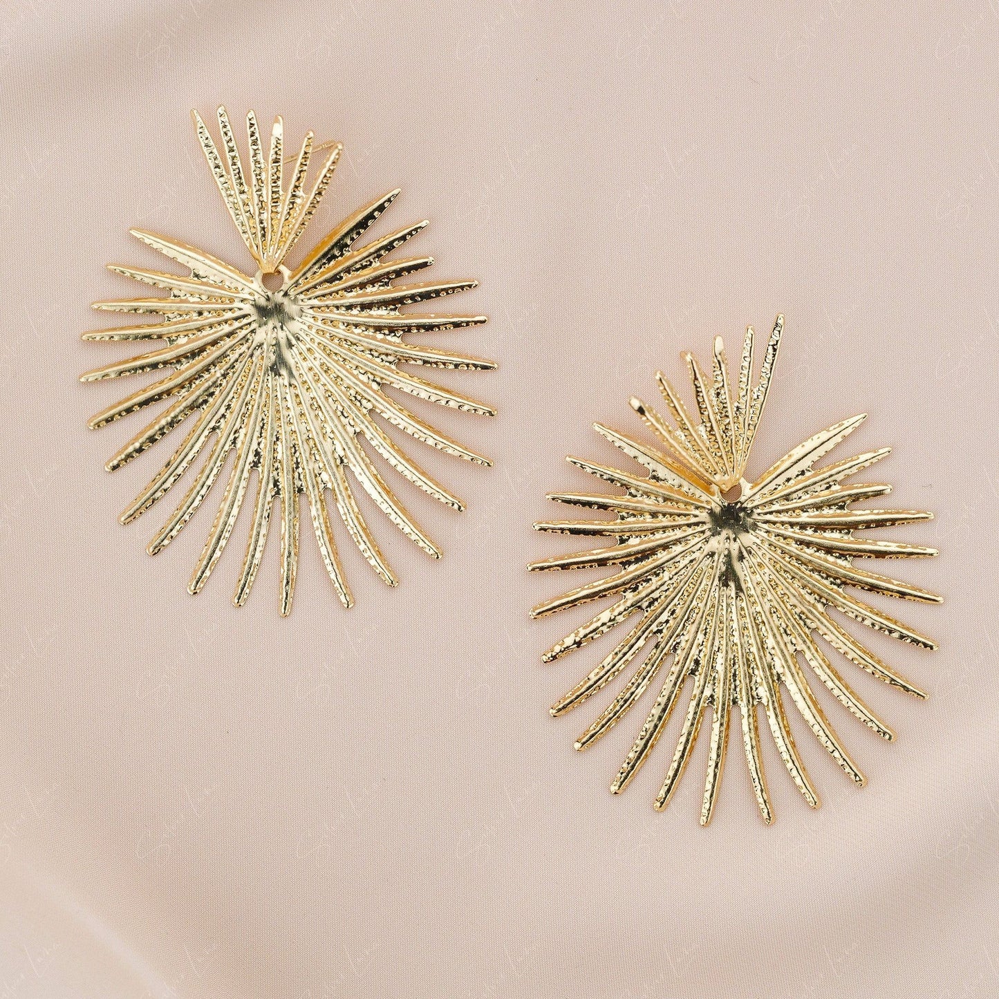 gold coconut leaves statement earrings