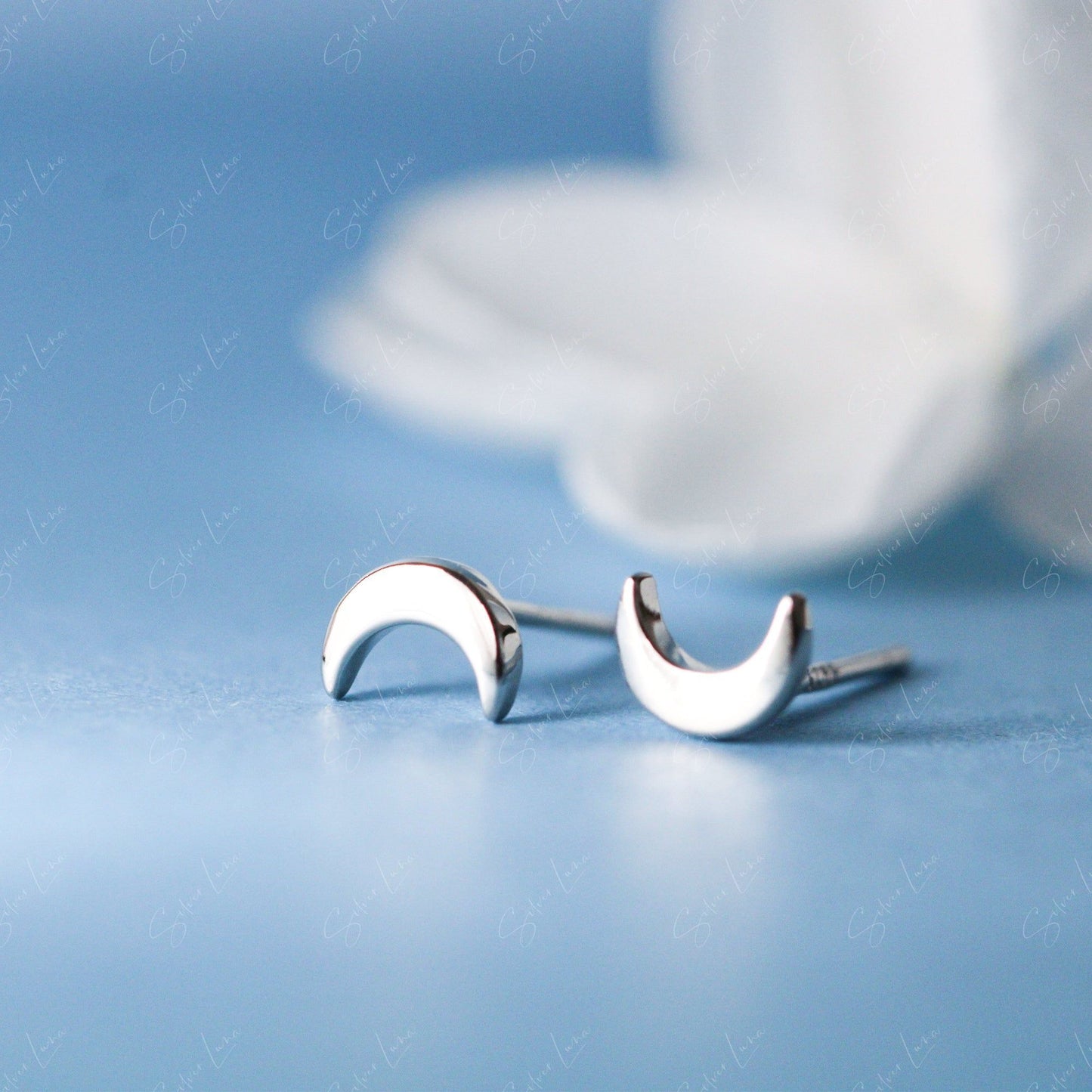 Tiny silver moon stud earrings