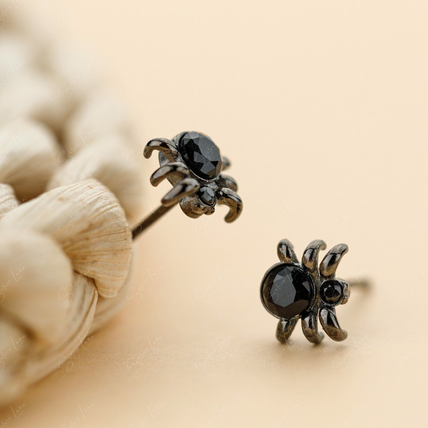 Tiny black spider stud earrings