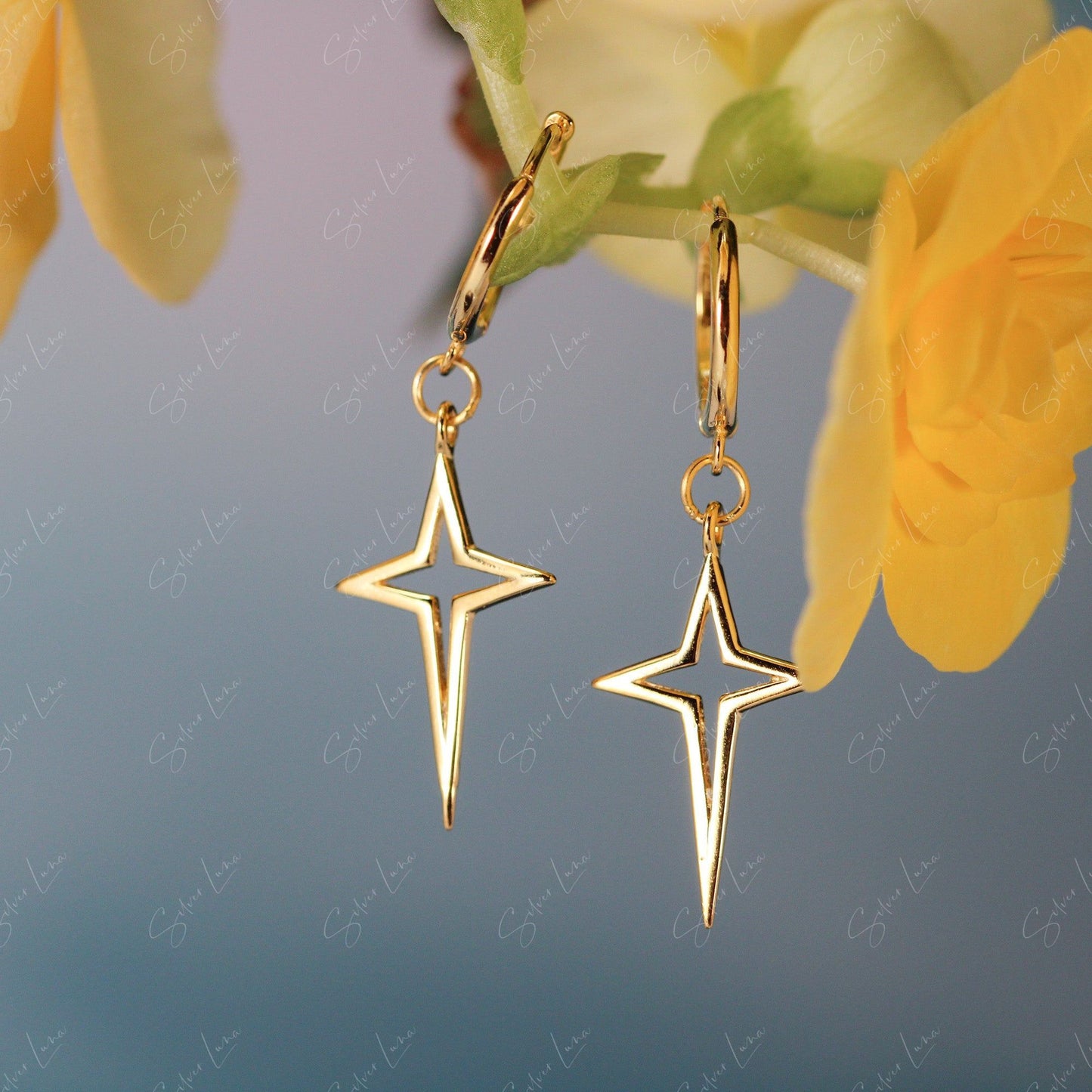 Pointed star cross hoop earrings
