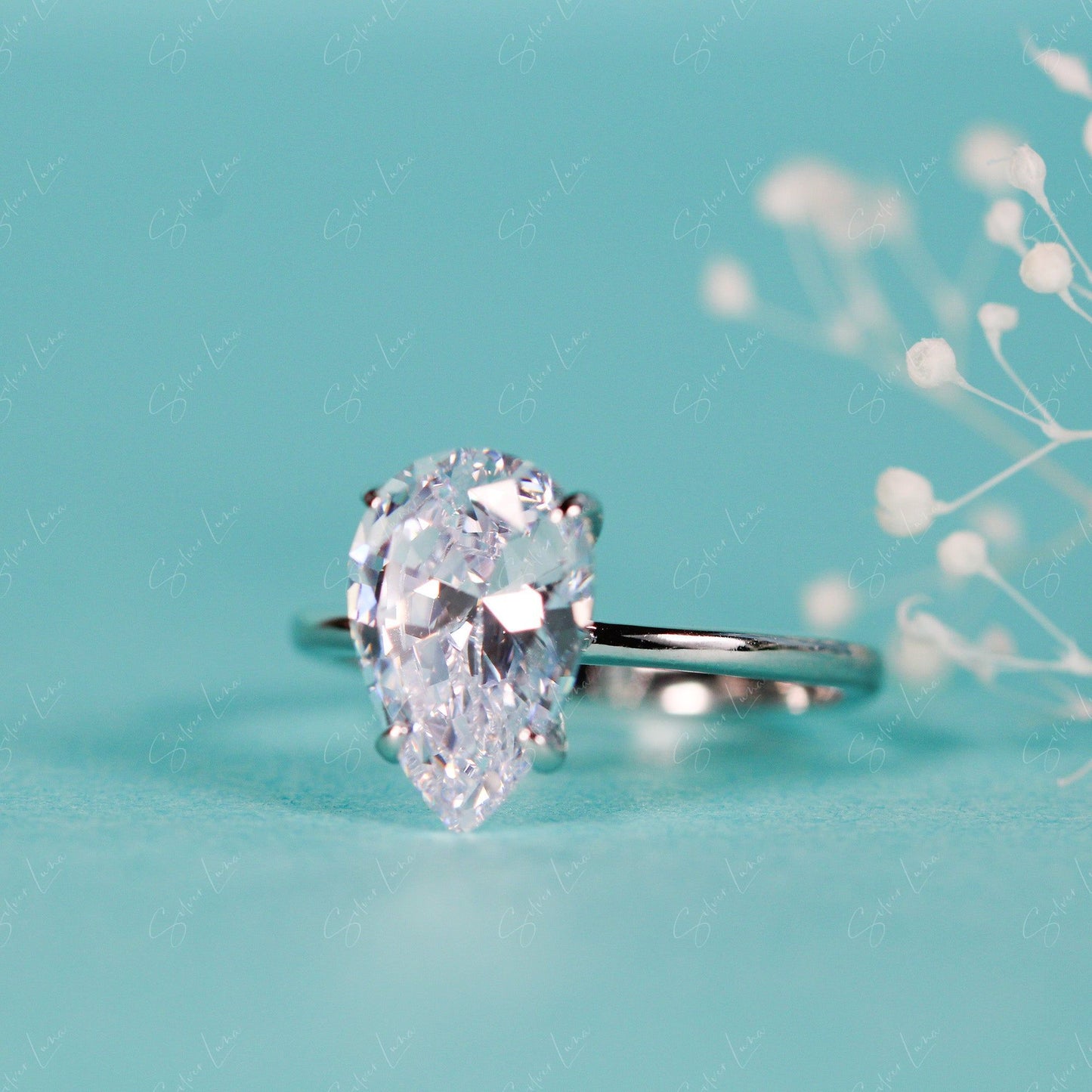 Cubic zirconia tear drop engagement ring